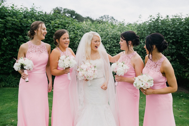 bridesmaids in pink at Sanhole Oak Barn