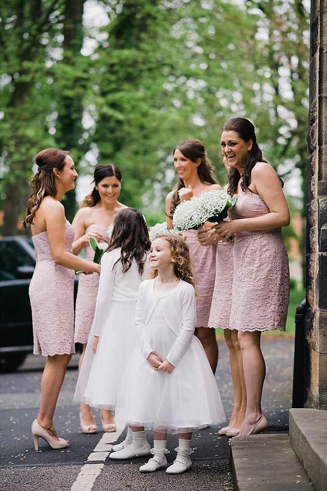 bridesmaids in pink at a church wedding chorley