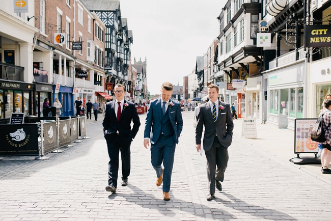 Groom walking to Chester Town Hall wedding