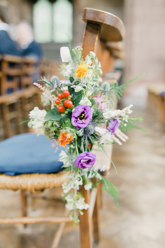 bright summer wedding flowers at church in stoke