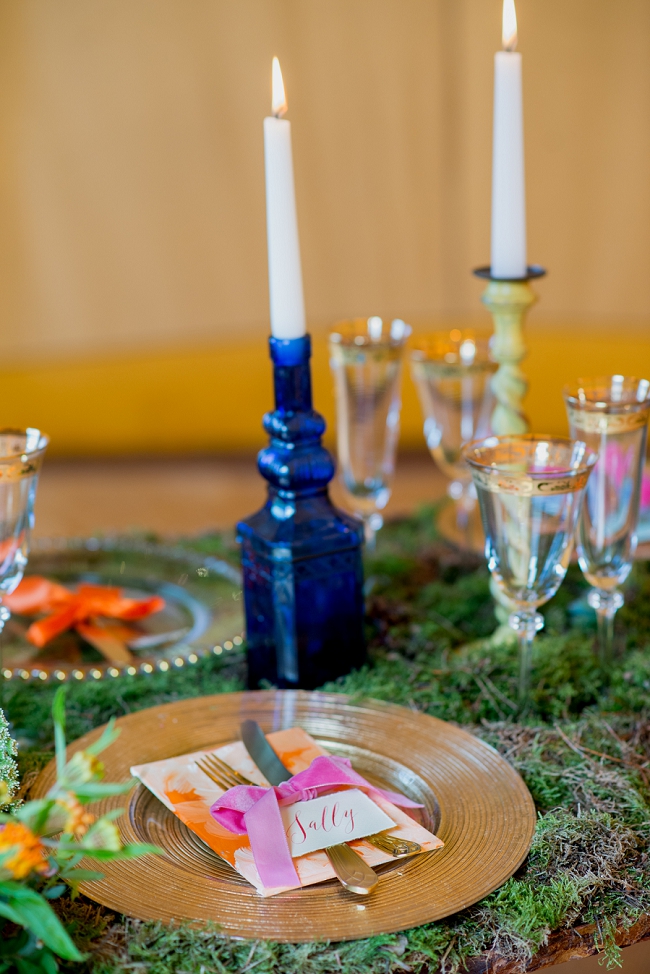 wedding table blue vases green moss