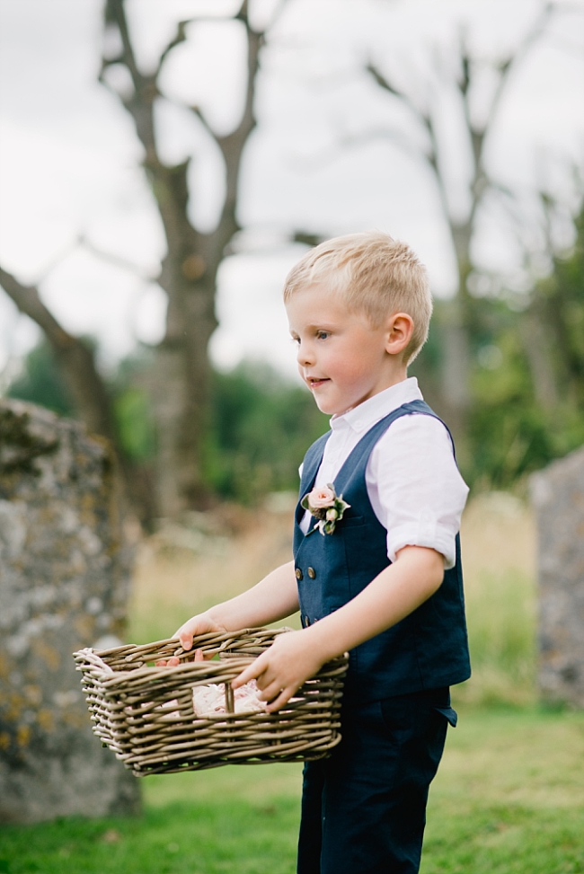 page boy with basket of confetti