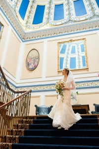 bride on staircase at shrigley hall hotel