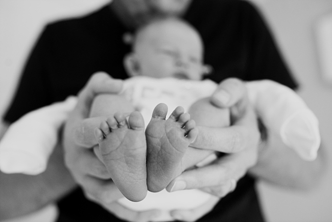 baby's feet black and white photo