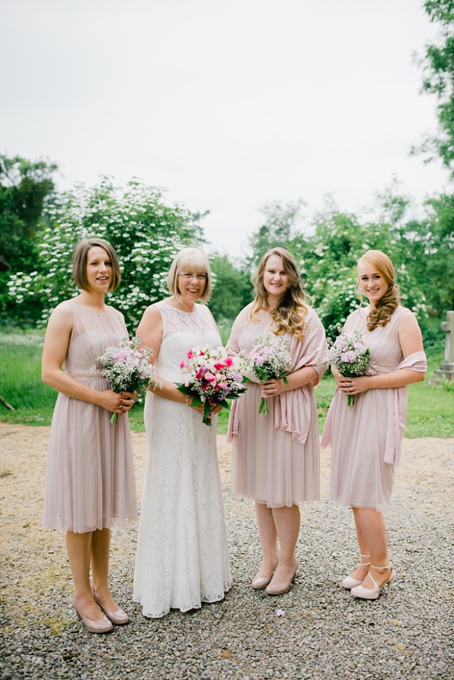 bride and bridesmaids in pale pink