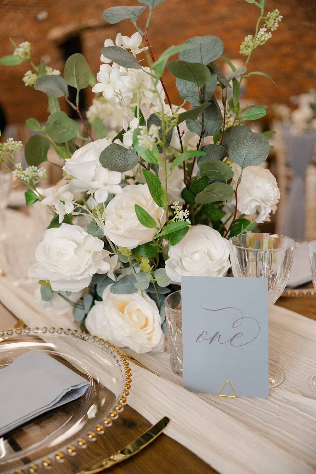 wedding flowers with blue table sign