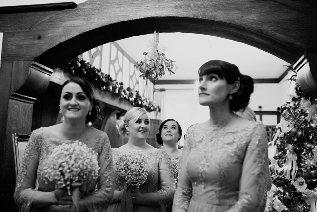 bridesmaids under mistletoe