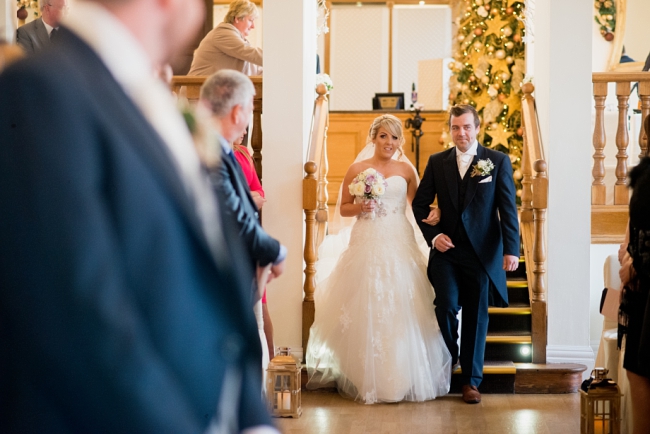 bride walks down aisle with brother