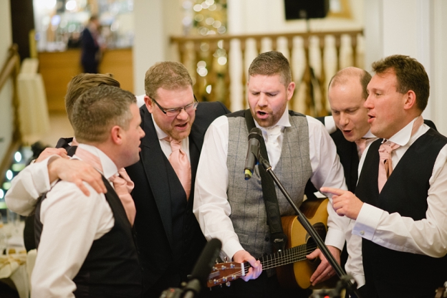 groom singing at wedding