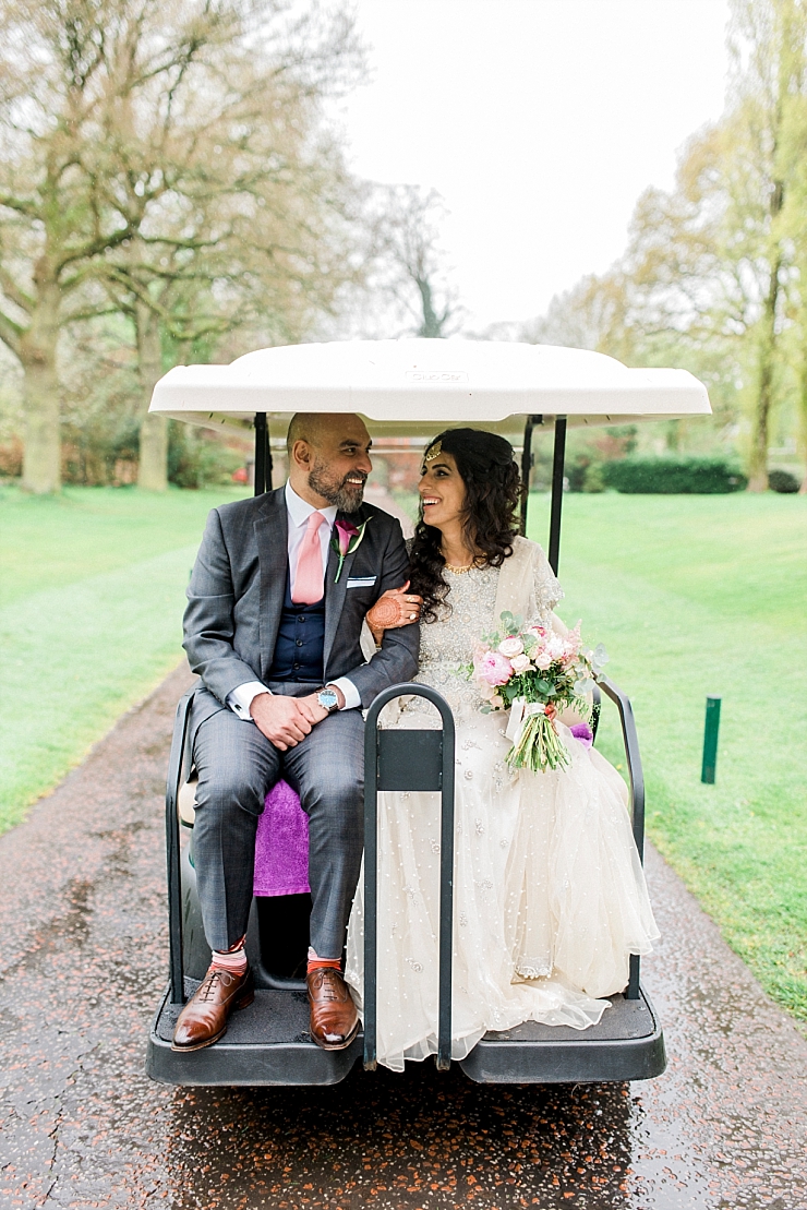 bride and groom on golf buggy