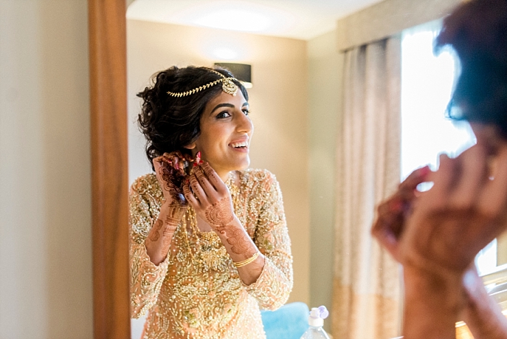 bride in mirror with earring