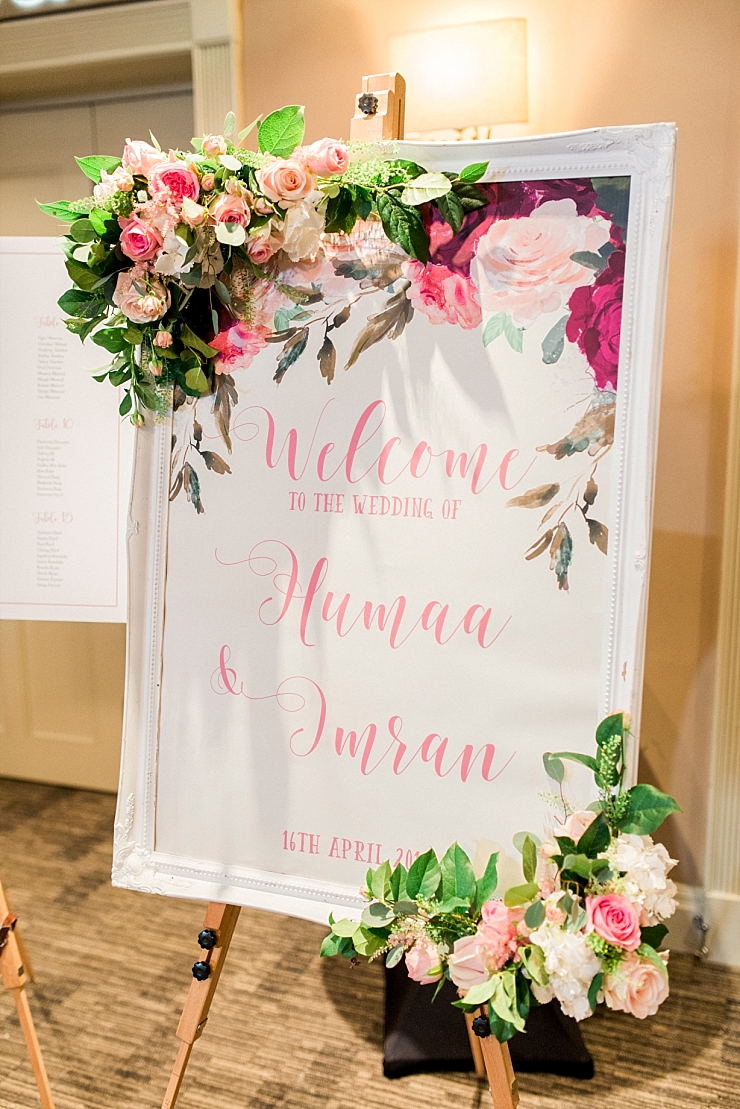 wedding sign with calligraphy and flowers