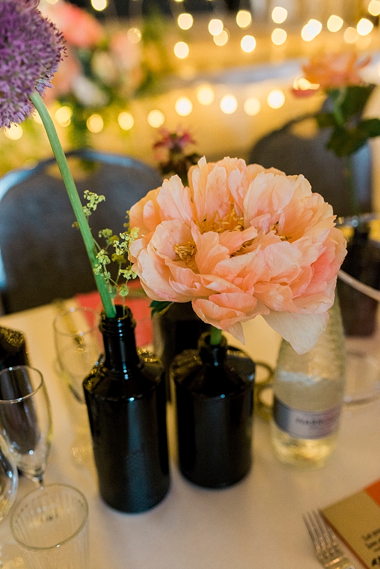 wedding flowers in brown bottles
