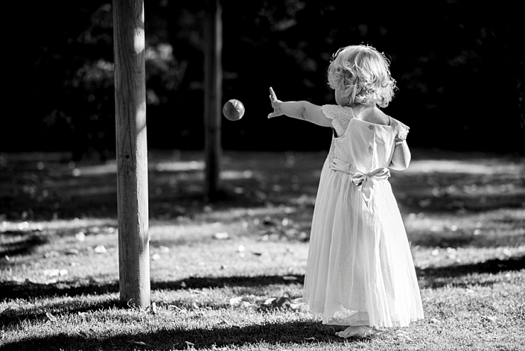 flower girl throws ball