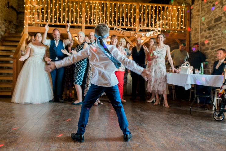 little boy dancing at wedding