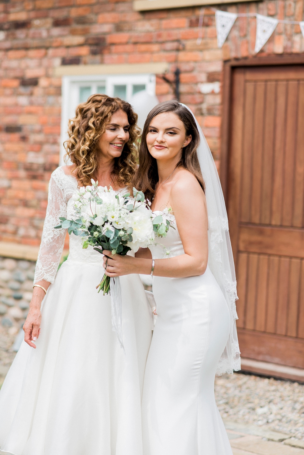 mother of the bride in an ivory lace dress