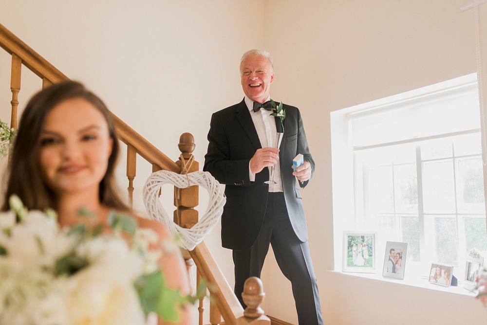 father of the bride on stairs