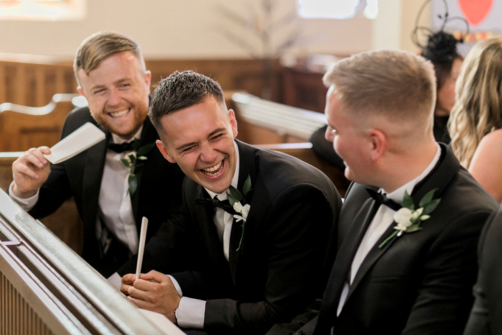 best man laughing in church