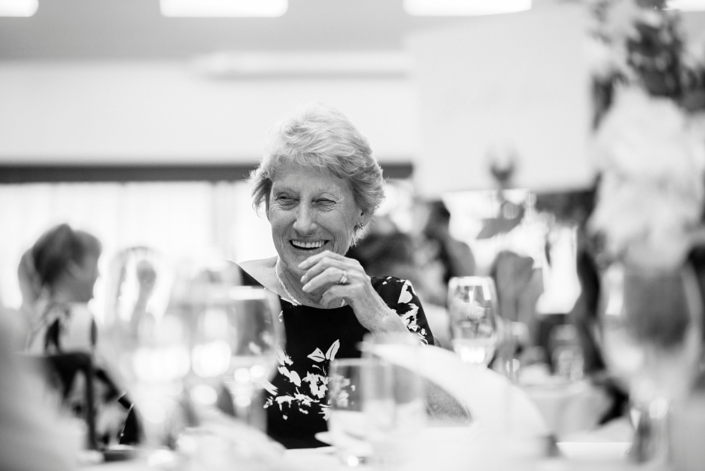 wedding guest laughing at speeches