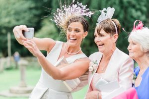 wedding guests take selfie