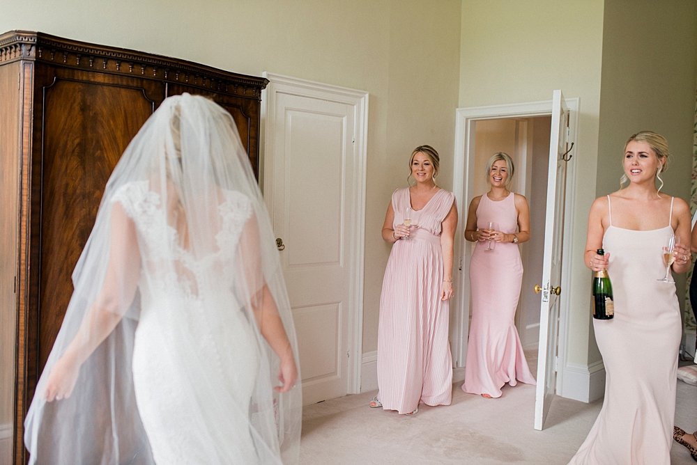 bridesmaids see the bride for the first time at Ardington House
