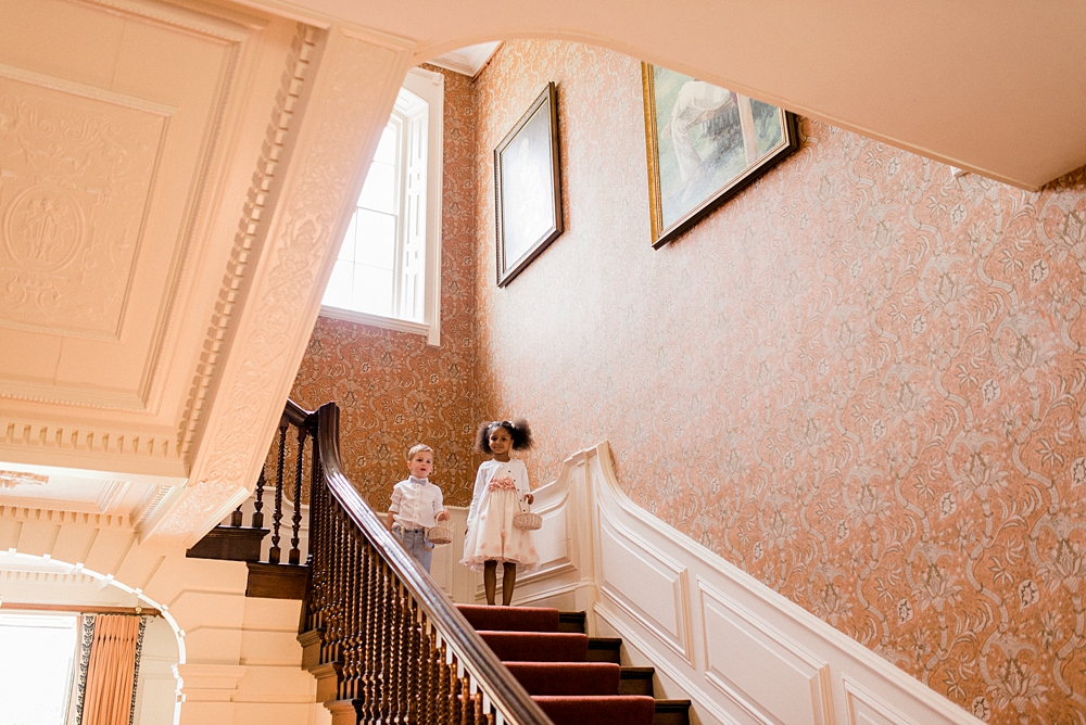 page boy and flower girl on stairs at Ardington House