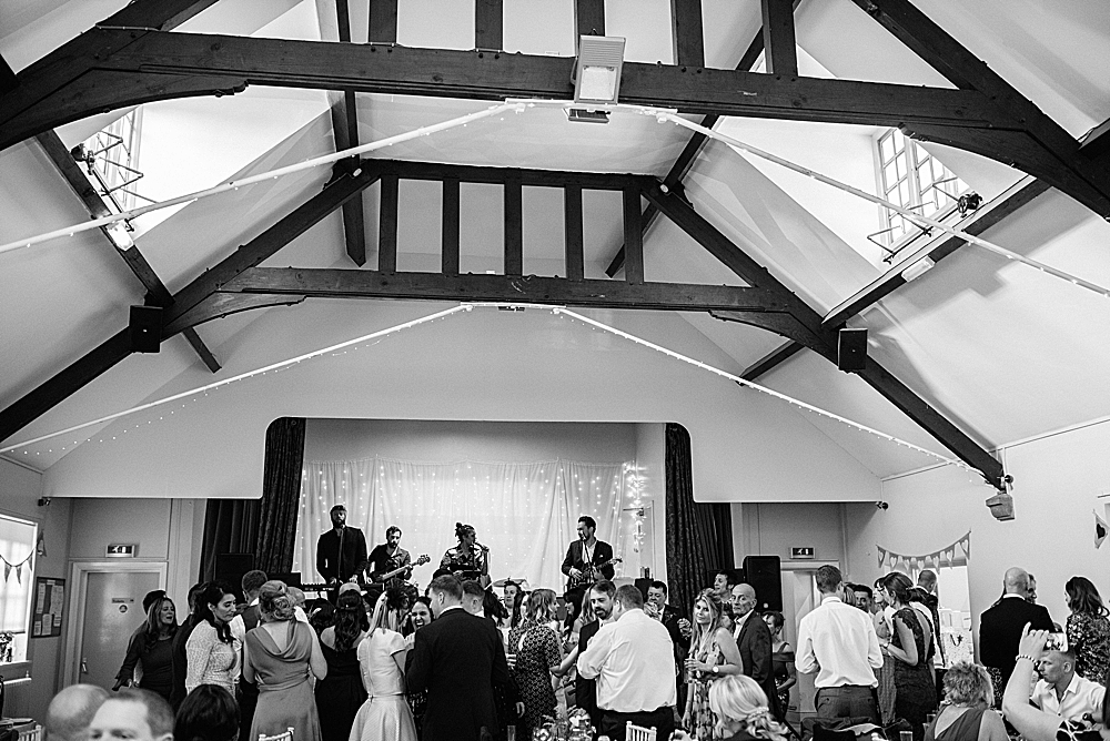 band playing on stage at Eccleston Village hall wedding