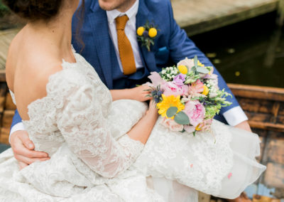 bride and groom in a boat