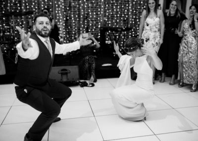 bride and groom first dance squats