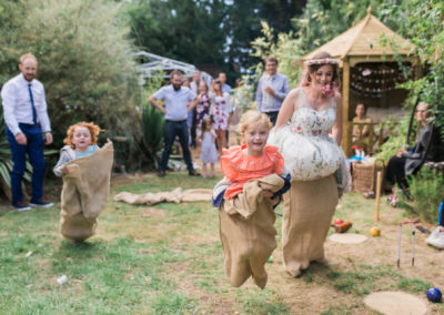 bride and children having a sack race