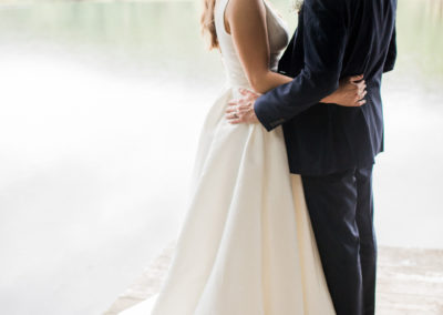 bride and groom on jetty at wyresdale park