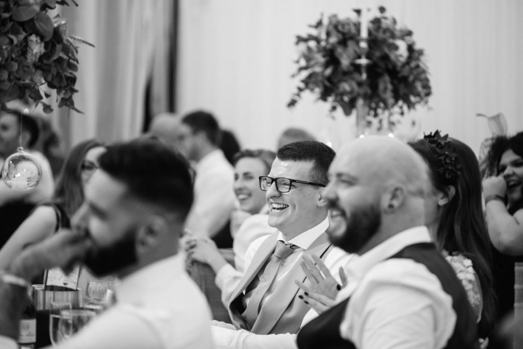 guest laughing at a marquee wedding