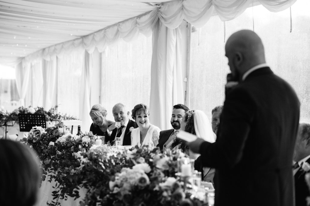 mother of the bride laughs at best man's speech