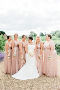 bride and bridesmaids wearing sparkly pink at Walton hall wedding
