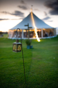candles light the path to marquee