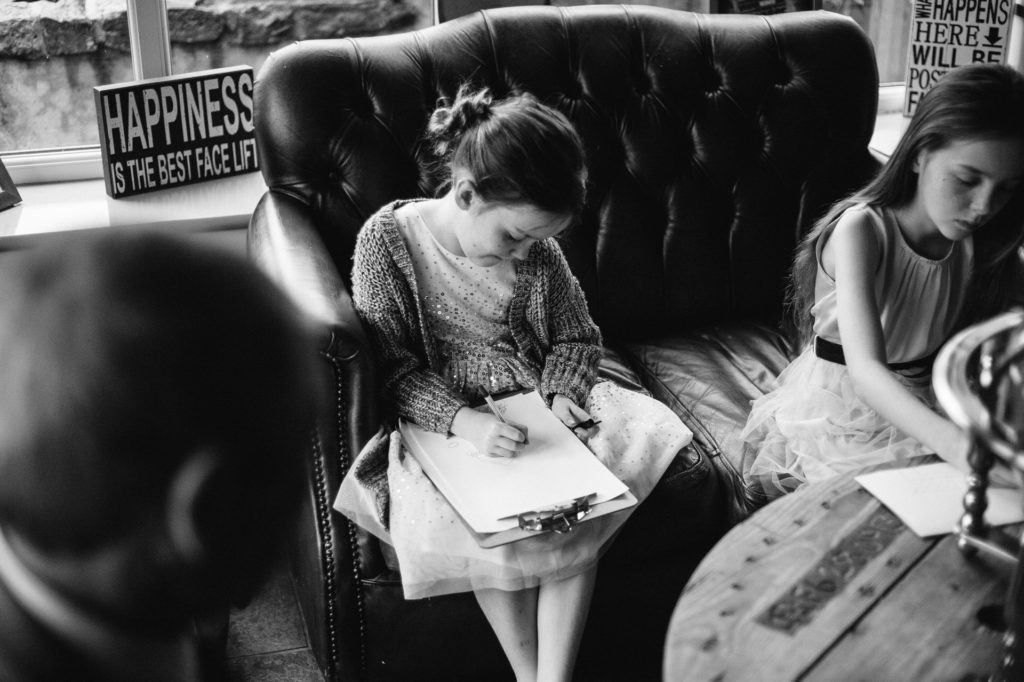 little girl drawing at wedding