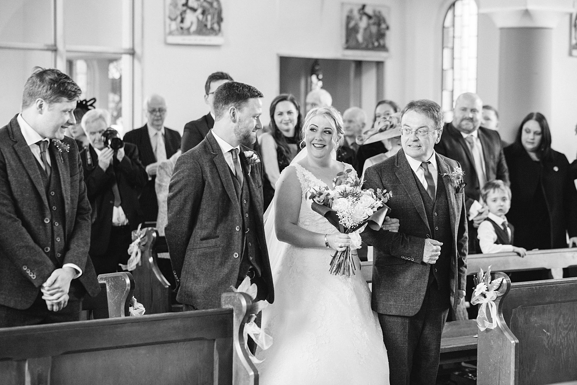 bride and her dad walk down the aisle to groom
