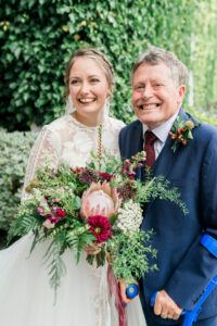 bride and her dad smiling