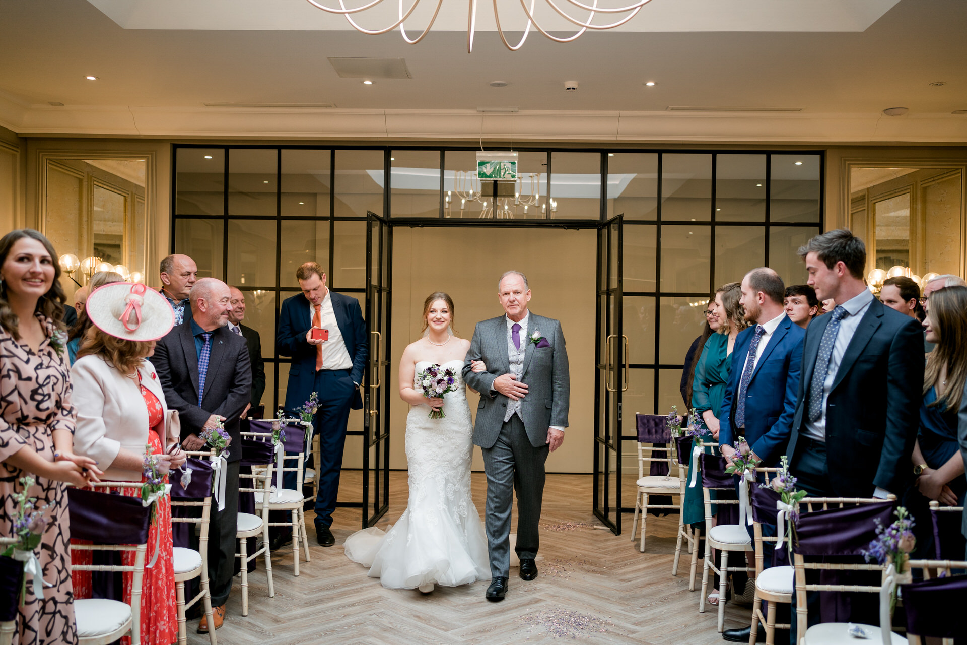 bride and her dad walk down the aisle at woodlands hotel Leeds