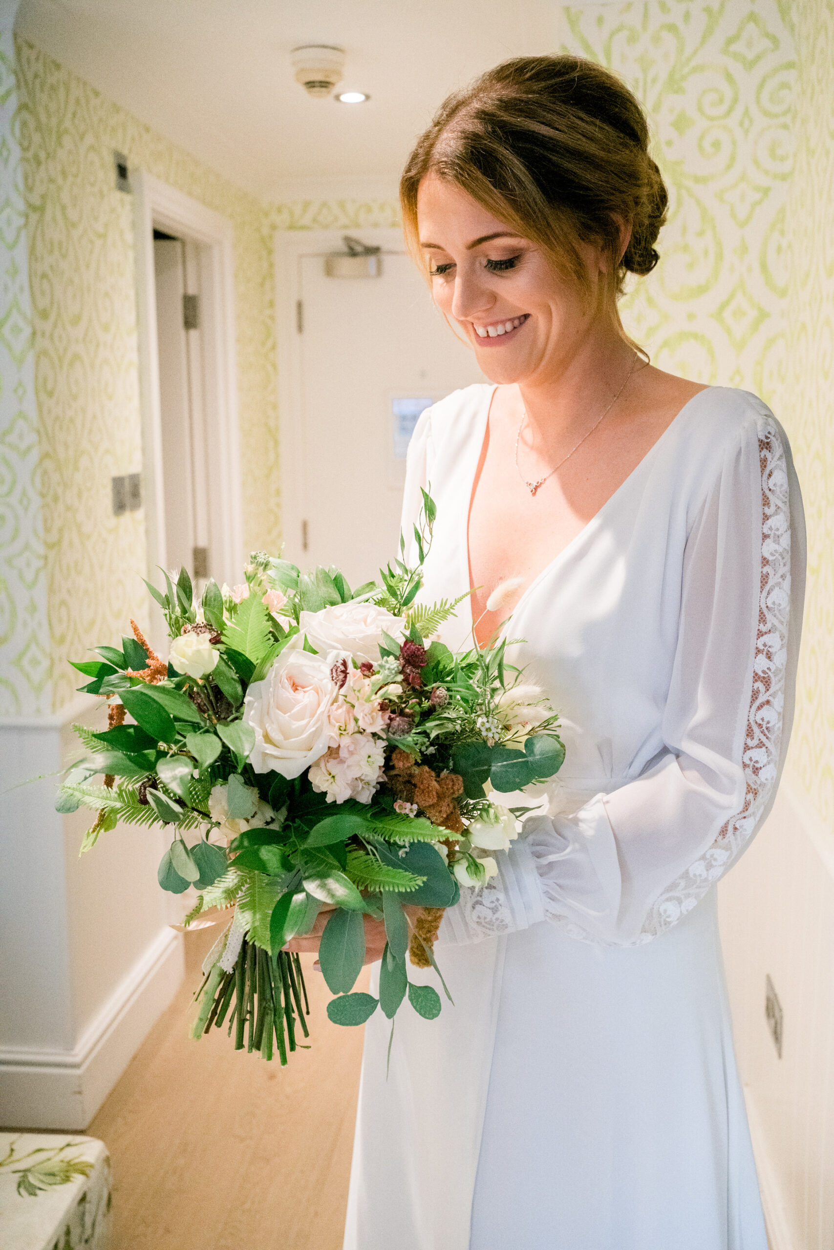 bride and her bouquet at the swan hotel newby bridge