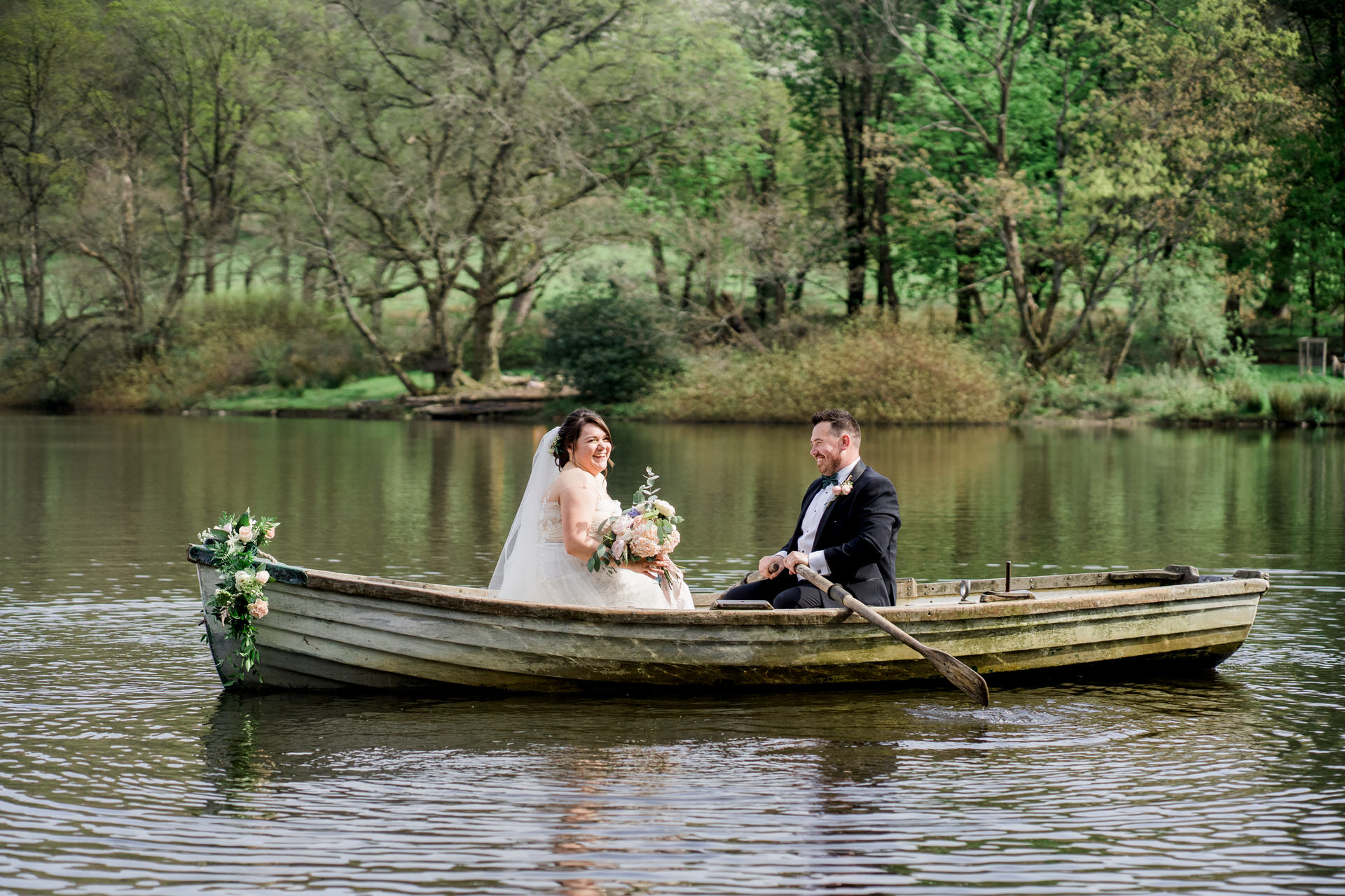 WYRESDALE PARK WEDDING bride and groom in a boat