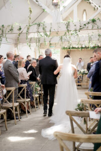 wyresdale park wedding ceremony bride walks down aisle with dad