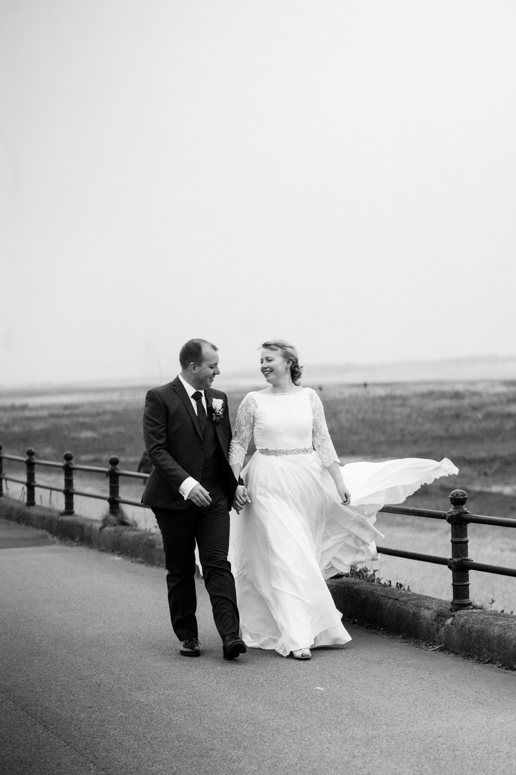 Clifton arms wedding photography bride and groom walk on promenade