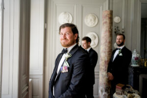 groom waiting nervously at chateau de brives