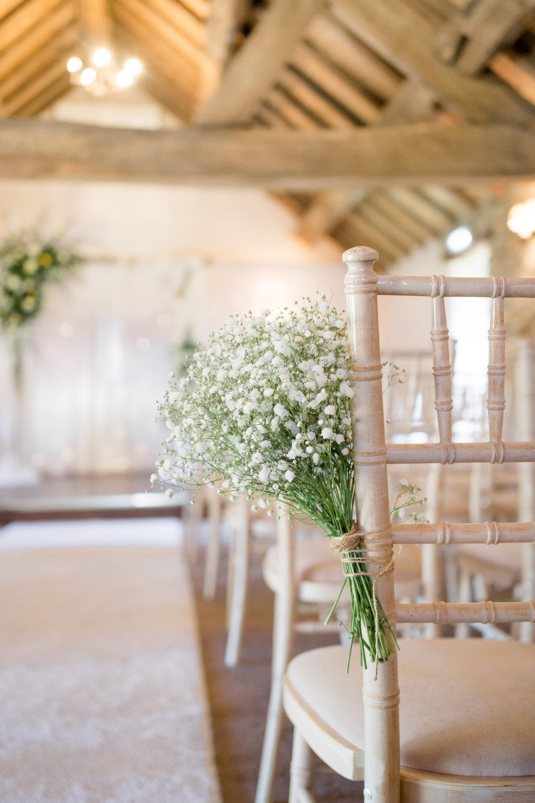 gysophila bouquet on chairs fro wedding ceremony at Hyde bank farm