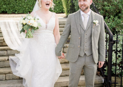 bride and groom walk down steps at Hyde bank farm wedding