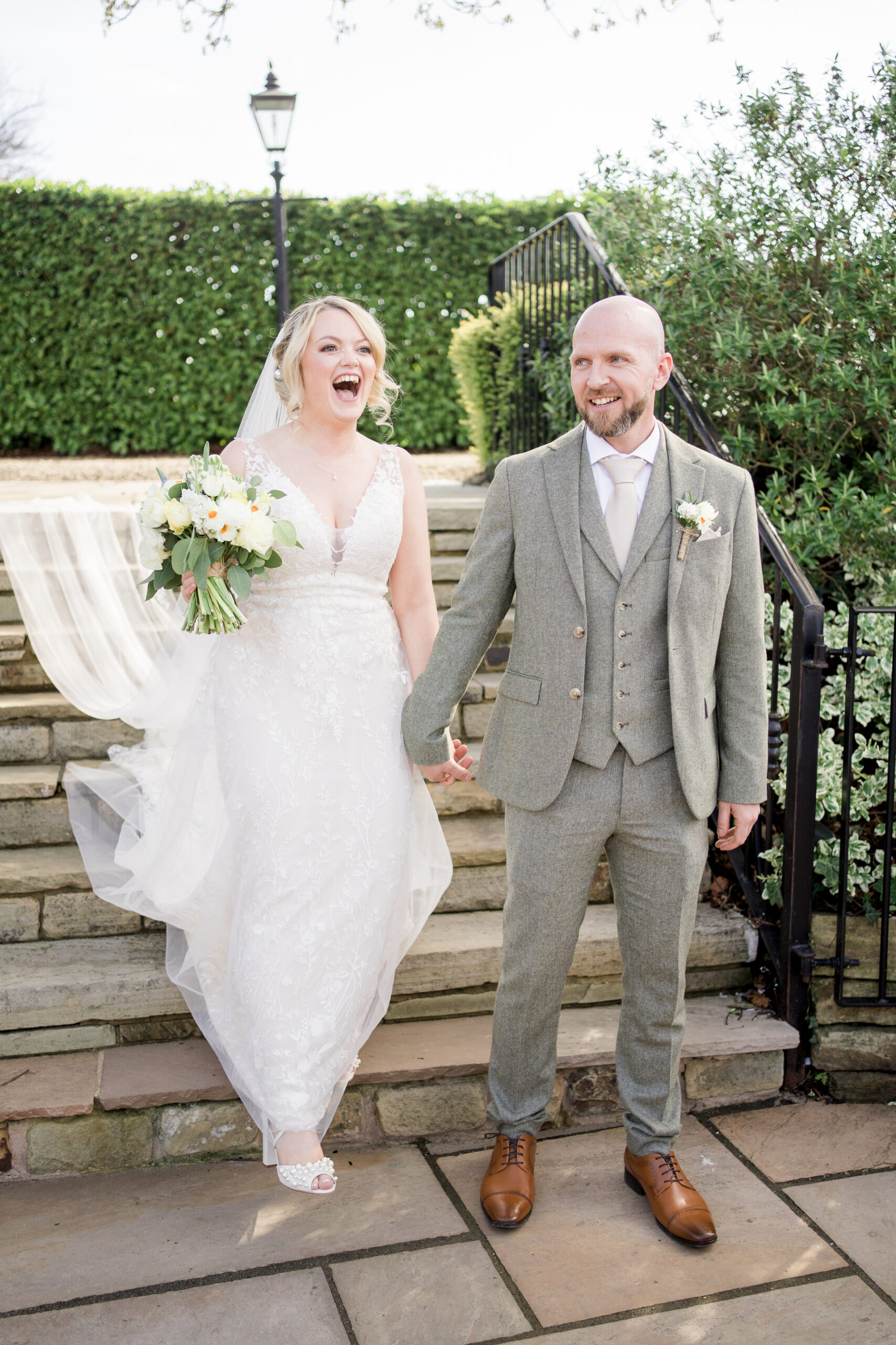 bride and groom walk down steps at Hyde bank farm wedding