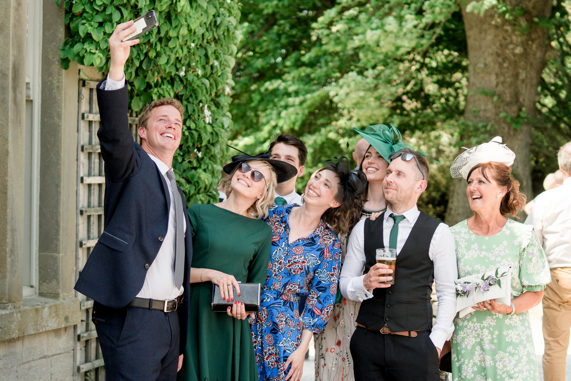 a wedding at underley grange with guests taking a selfie