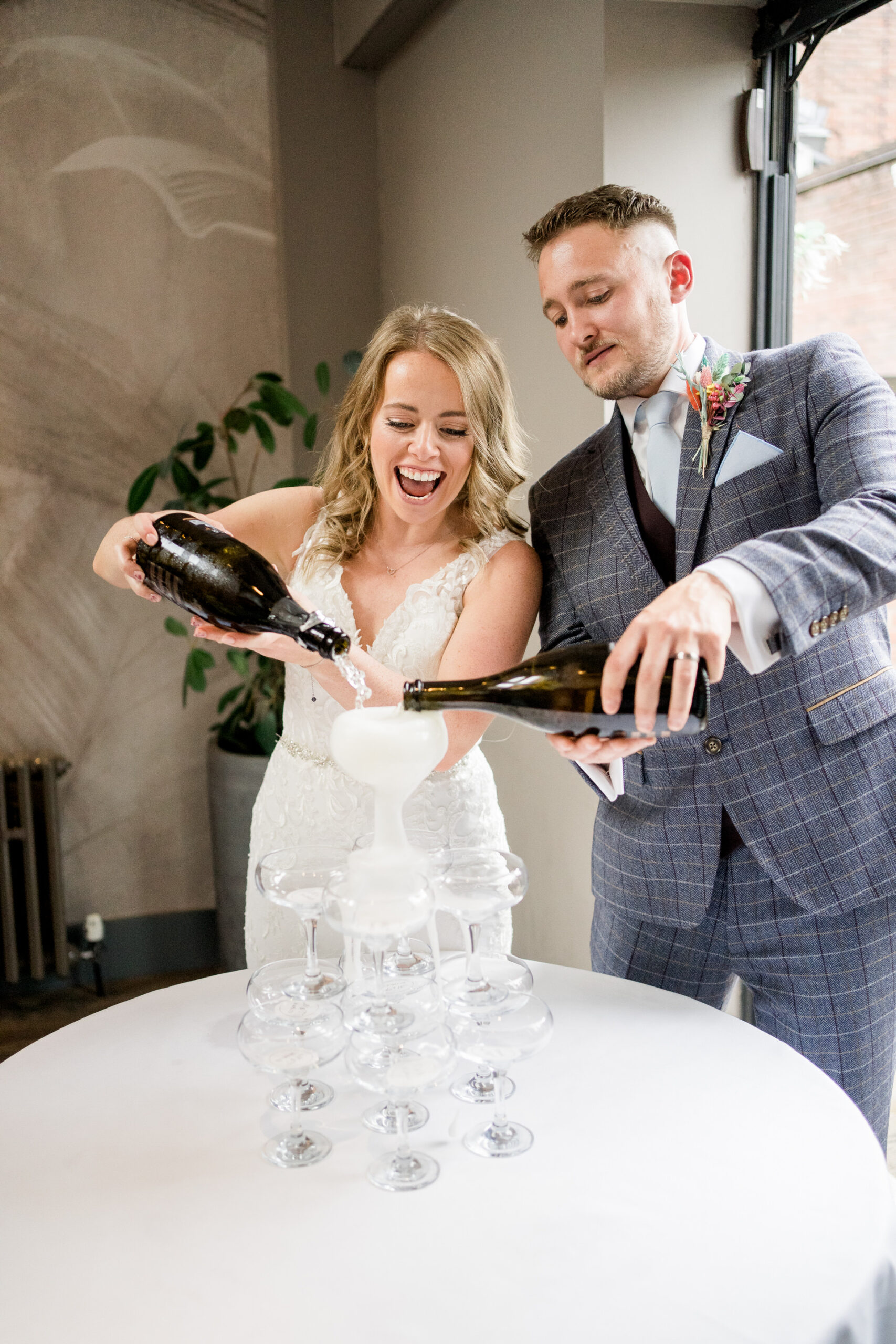 a wedding at the castlefield rooms in Manchester with a champagne tower for the bride and groom