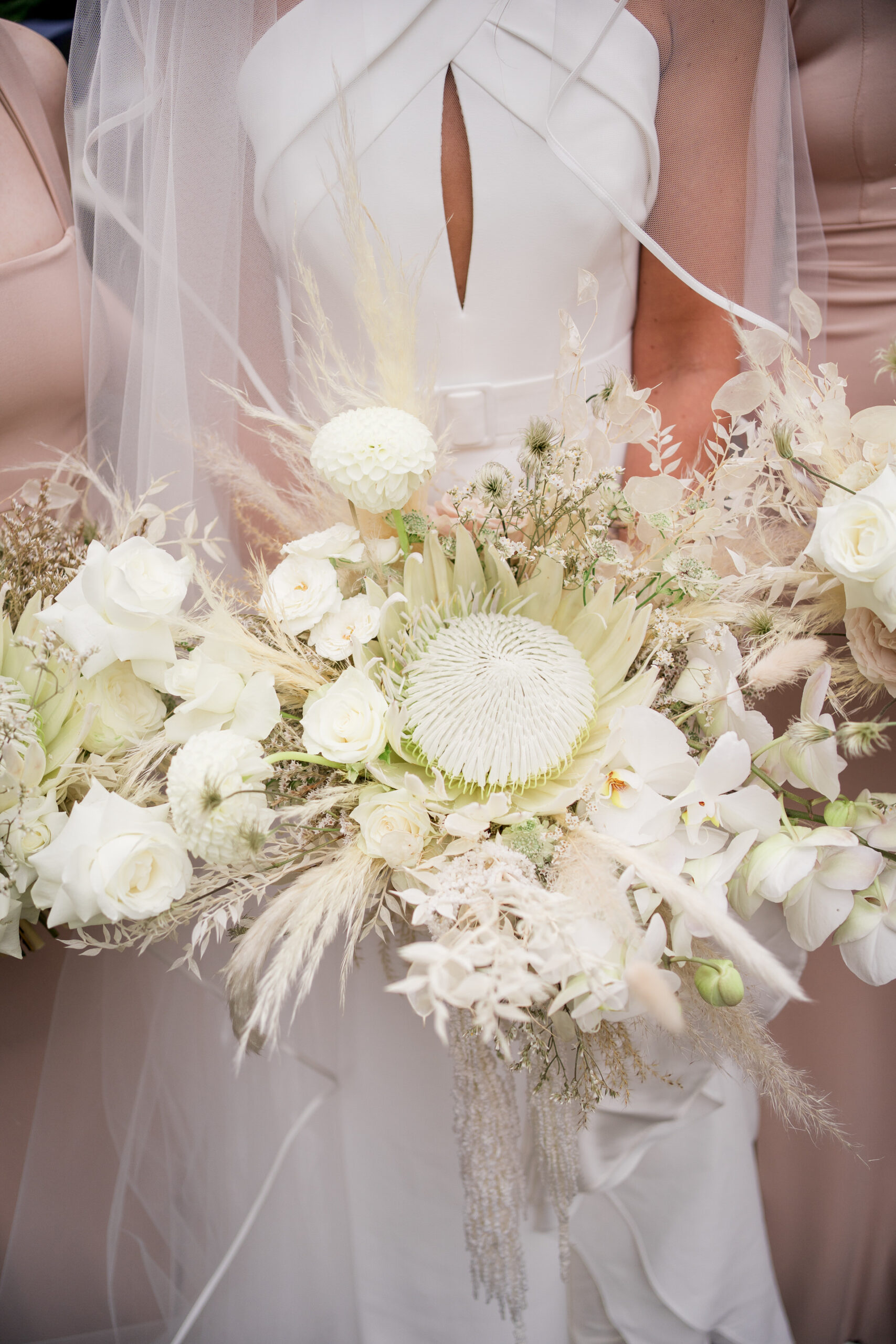 protea bouquet in cream by red floral